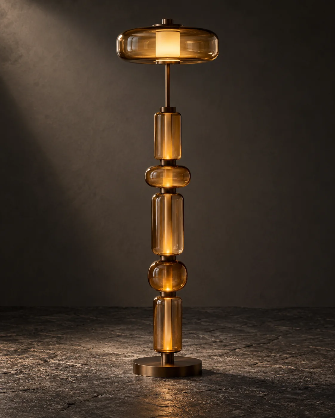 Amber glass sculptural floor lamp in a dark gallery